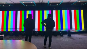 The technician is setting up the screen