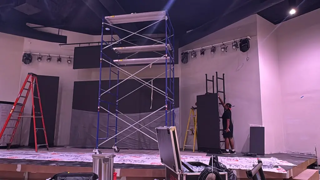 Staff are installing the screen